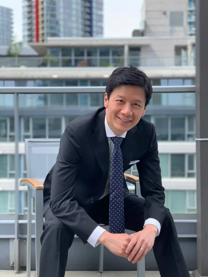 Alan Yeh seated on a Vancouver balcony